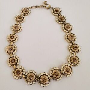 A beautiful flower necklace with intricate design.